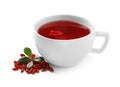 Healthy goji tea in cup with berries on white Royalty Free Stock Photo