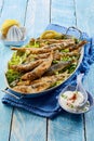 Healthy Greek cuisine with fried battered sardines