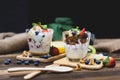 Healthy Greek yogurt with Granola and mixed berries on wooden ta