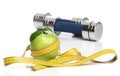 Healthy green apple and a measuring tape