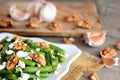 Healthy green beans salad with balsamic dressing. Warm green bean salad with cottage cheese, walnuts, garlic and spices