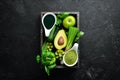 Healthy Green food Clean eating selection Protein source for vegetarians: avocado, lime, onion, apple, kiwi, spirulina.