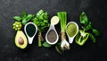 Healthy Green food Clean eating selection Protein source for vegetarians: avocado, lime, onion, apple, kiwi, spirulina.