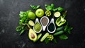 Healthy Green food Clean eating selection Protein source for vegetarians: avocado, lime, onion, apple, kiwi, spirulina.