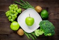 healthy green food with fresh vegetables on wooden table background top view Royalty Free Stock Photo