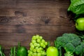 Healthy green food with fresh vegetables on wooden table background top view mock up Royalty Free Stock Photo