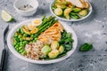 Healthy grilled vegetables buddha bowl with chicken and quinoa, spinach, egg, zucchini, asparagus, Brussels sprouts and green peas Royalty Free Stock Photo