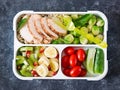 Healthy green meal prep containers with chicken fillet, rice, brussels sprouts Royalty Free Stock Photo