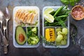 Healthy green meal prep containers with rice and vegetables
