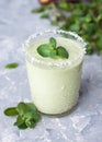 Healthy green milkshake or smoothie with avocado and mint