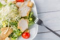 Healthy green organic caesar salad close up on white plate and fork Royalty Free Stock Photo