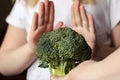 Healthy Green Organic Raw Broccoli. child rejecting to eat broccoli