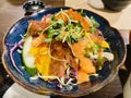 Japanese salmon salad with a variety of vegetables, cucumber, cabbage, salmon, seaweed and ebiko masago eggs Royalty Free Stock Photo