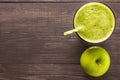 Healthy green smoothie with apple on rustic wood background Royalty Free Stock Photo