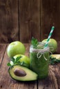 Healthy green smoothie with avocado and green apple