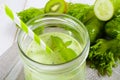 Healthy green smoothie in jar with cucumber, kiwi, salad and spices Royalty Free Stock Photo