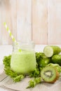 Healthy green smoothie in jar with cucumber, kiwi, salad and spices Royalty Free Stock Photo