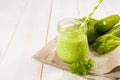 Healthy green smoothie in jar with cucumber, salad and spices Royalty Free Stock Photo