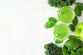 Healthy green smoothie side border, top view over a white marble background with copy space Royalty Free Stock Photo