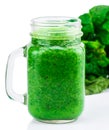 Healthy green smoothie with spinach in a jar mug isolated on whi Royalty Free Stock Photo