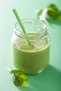 Healthy green smoothie with spinach mango banana in glass jar Royalty Free Stock Photo