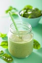 Healthy green smoothie with spinach mango banana in glass jars Royalty Free Stock Photo