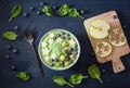 Healthy green spinach smoothie bowl with blueberry, banana stars Royalty Free Stock Photo