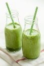 Healthy green spinach smoothie with cilantro lime banana ginger Royalty Free Stock Photo