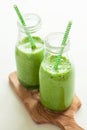 Healthy green spinach smoothie with cilantro lime banana ginger Royalty Free Stock Photo