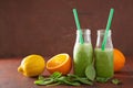 Healthy green spinach smoothie with lemon orange Royalty Free Stock Photo