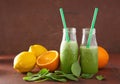 Healthy green spinach smoothie with lemon orange Royalty Free Stock Photo