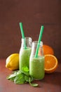 Healthy green spinach smoothie with lemon orange Royalty Free Stock Photo