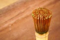 Healthy green tea in cup and bamboo whisk. Royalty Free Stock Photo