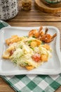 Healthy Grilled Caesar Salad with shrimp, parmesan Cheese and Croutons on wooden table Royalty Free Stock Photo