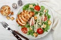 Healthy Grilled Chicken Caesar Salad with iceberg or lettuce, Cheese Parmesan, cherry tomatoes, bread Croutons and gourmet sauce Royalty Free Stock Photo