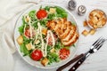 Healthy Grilled Chicken Caesar Salad with iceberg or lettuce, Cheese Parmesan, cherry tomatoes, bread Croutons and gourmet sauce Royalty Free Stock Photo