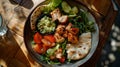 Healthy grilled chicken salad meal on rustic wooden table. wholesome balanced diet concept. casual dining restaurant Royalty Free Stock Photo