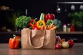 Healthy grocery scene Fresh vegetables in paper bag on table Royalty Free Stock Photo