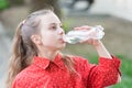 Healthy habits. Healthy and hydrated. Girl care about health and water balance. Girl cute kid hold water bottle. Water