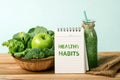 the HEALTHY HABITS message and the Healthy fresh green smoothie Royalty Free Stock Photo