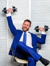 Healthy habits in office. Strong powerful business strategy. Man raise heavy dumbbells. Boss businessman manager raise Royalty Free Stock Photo