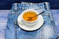 Healthy habits. Tea time concept. Cup mug hot water and bag of tea. Mug filled boiling water and tea bag on blue jeans