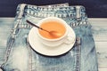 Healthy habits. Tea time concept. Cup mug hot water and bag of tea. Mug filled boiling water and tea bag on blue jeans Royalty Free Stock Photo