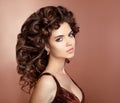 Healthy hair. Beautiful brunette girl model with long curly hair Royalty Free Stock Photo