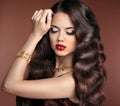 Healthy hair. Makeup. Beautiful brunette girl with long wavy hai Royalty Free Stock Photo