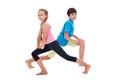 Kids doing leg strengthening and flexibility exercises Royalty Free Stock Photo