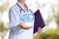 Healthy heart in the hand of the doctor. Royalty Free Stock Photo