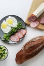 Healthy hearty American breakfast scrambled eggs fried ham eggs and bread on a gray plate on a white background top view Royalty Free Stock Photo