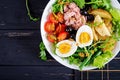 Healthy hearty salad of tuna, green beans, tomatoes, eggs, potatoes, black olives Royalty Free Stock Photo