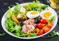 Healthy hearty salad of tuna, green beans, tomatoes, eggs, potatoes, black olives Royalty Free Stock Photo